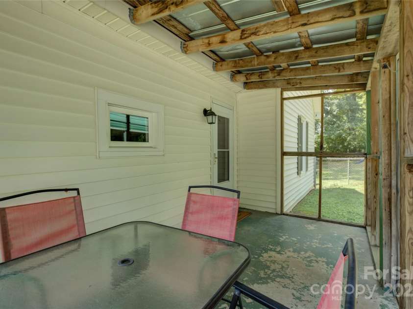 2111 Hodgin Street, Gastonia, NC 28056.  MLS# CAR4289182, YatesRealty ID 33638. Serene screened porch
