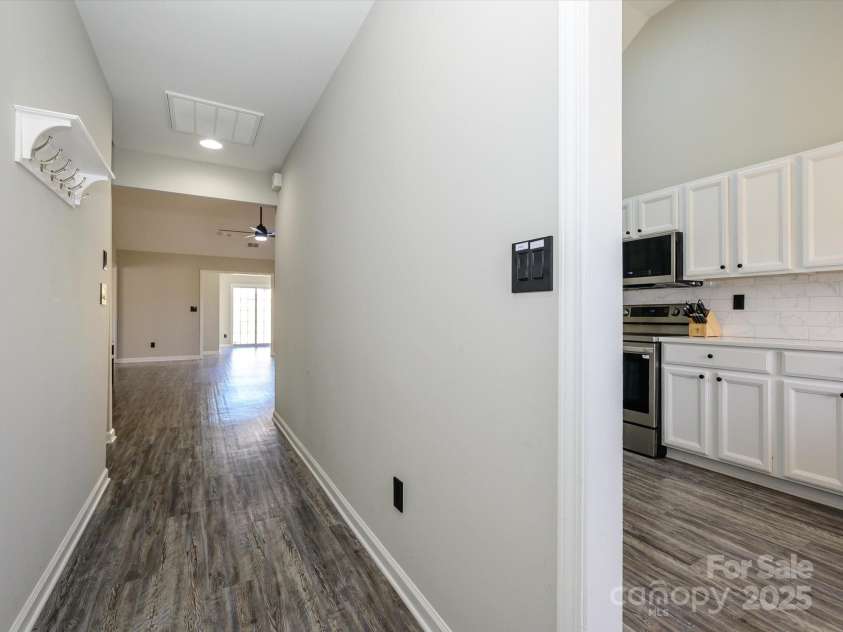 7220 Hidden Creek Drive, Charlotte, NC 28214.  MLS# CAR4225936, YatesRealty ID 3364. Entry hall into home features vinyl plank flooring.