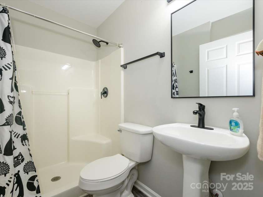 7220 Hidden Creek Drive, Charlotte, NC 28214.  MLS# CAR4225936, YatesRealty ID 3364. Main level has full bathroom for guests