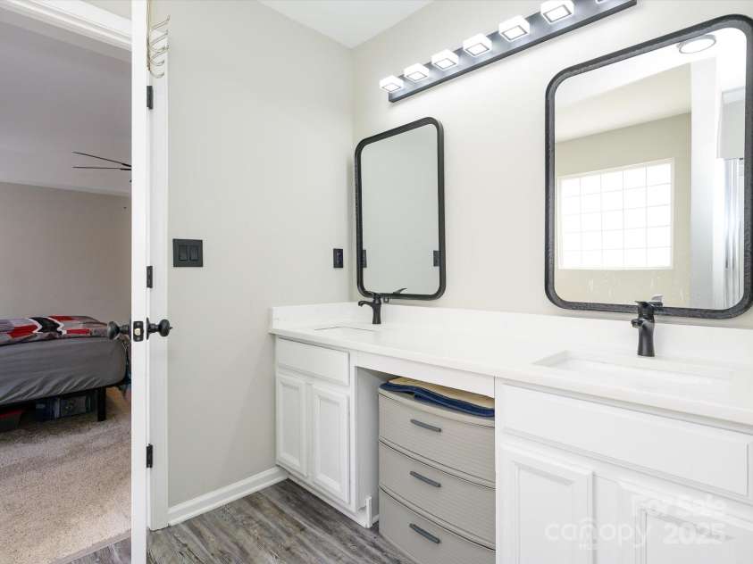 7220 Hidden Creek Drive, Charlotte, NC 28214.  MLS# CAR4225936, YatesRealty ID 3364. Primary bath with oversized dual vanity and room for additional storage or a vanity seat