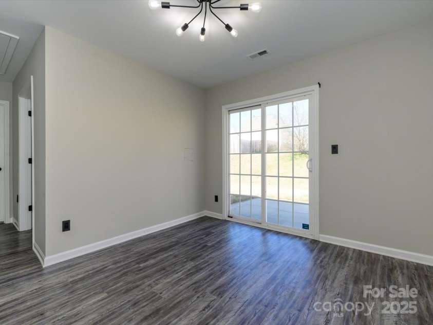 7220 Hidden Creek Drive, Charlotte, NC 28214.  MLS# CAR4225936, YatesRealty ID 3364. Sunroom/flex space has upgraded lighting