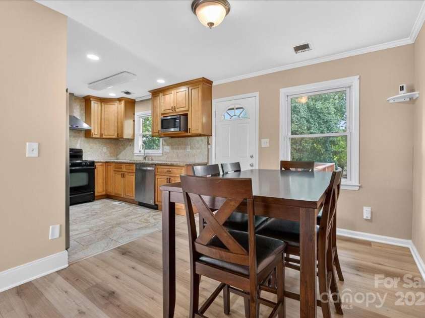 2221 Ludlow Drive, Charlotte, NC 28216.  MLS# CAR4292812, YatesRealty ID 33644. Alt view of kitchen from dining room