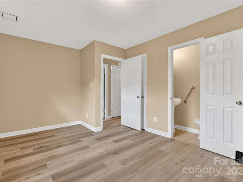 2221 Ludlow Drive, Charlotte, NC 28216.  MLS# CAR4292812, YatesRealty ID 33644. Primary Bedroom features a half bath