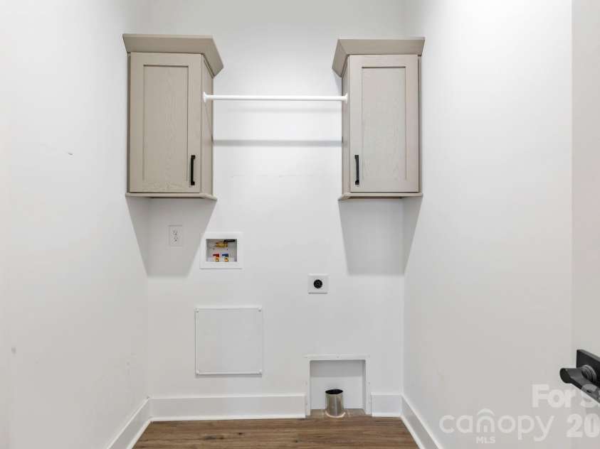 203 Southern Charm Road, Arden, NC 28704.  MLS# CAR4342838, YatesRealty ID 3365. Dedicated Laundry Room w/ access from the Primary Suite & Hall