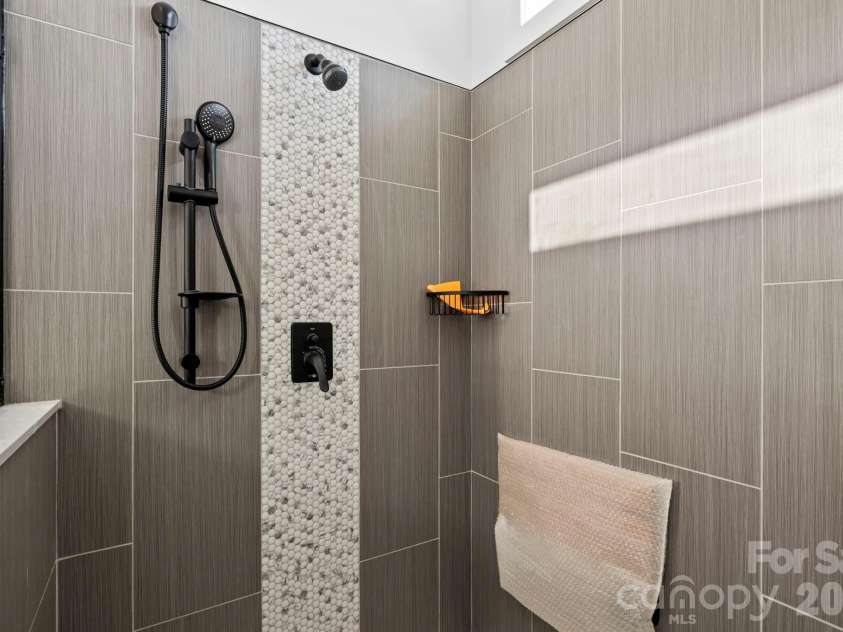 203 Southern Charm Road, Arden, NC 28704.  MLS# CAR4342838, YatesRealty ID 3365. Huge tile shower w/ flip down seat and 3 shower heads!