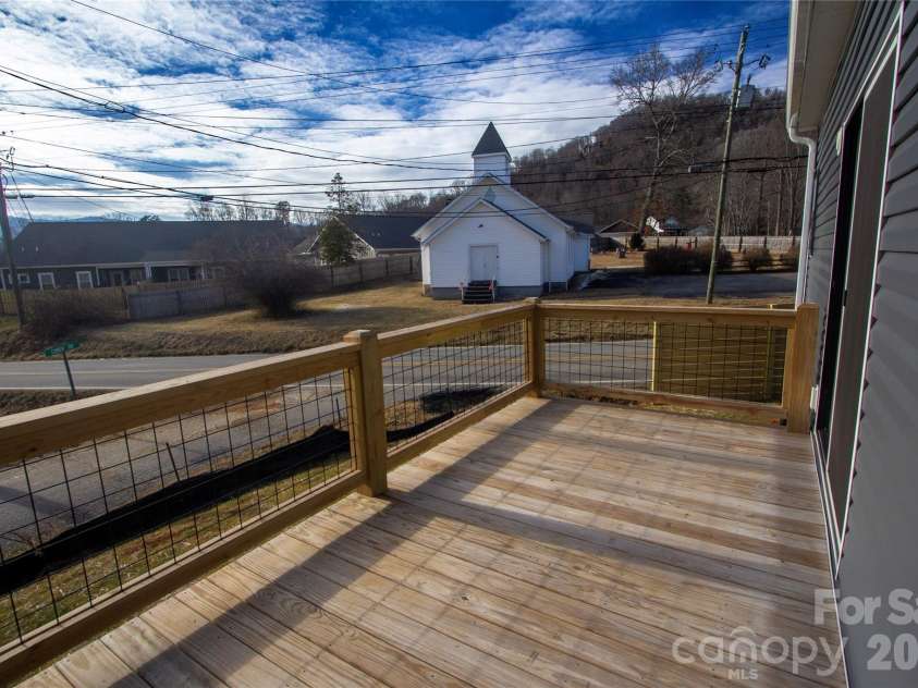 203 Southern Charm Road, Arden, NC 28704.  MLS# CAR4342838, YatesRealty ID 3365. Sunny rear deck w/ Mountain and chapel views