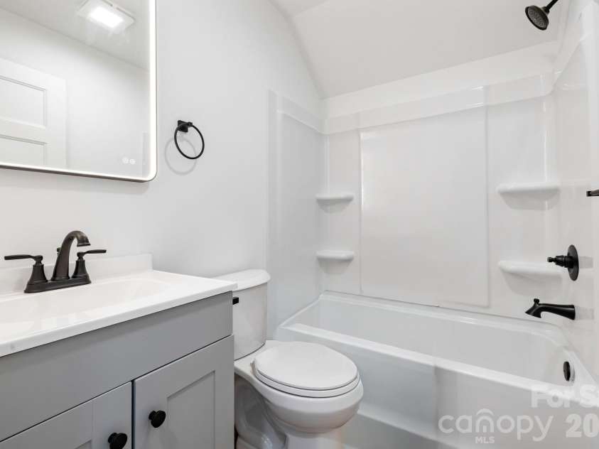 203 Southern Charm Road, Arden, NC 28704.  MLS# CAR4342838, YatesRealty ID 3365. Upstairs Bathroom w/ LED Lighted Mirror