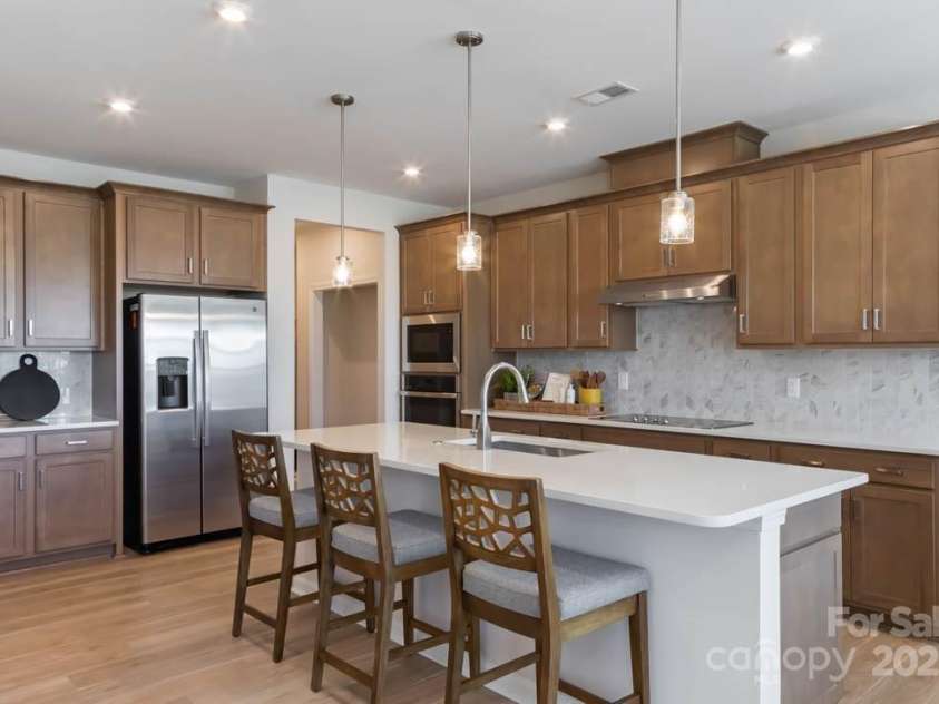 8928 Connover Hall Avenue, Charlotte, NC 28215.  MLS# CAR4199321, YatesRealty ID 3365. PLAN 3 MODEL KITCHEN |  This is a model of the home design. Please note that this is a representation only and the final construction may differ in appearance, features, and finishes