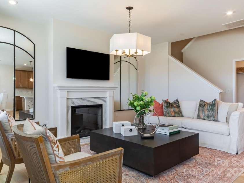 8928 Connover Hall Avenue, Charlotte, NC 28215.  MLS# CAR4199321, YatesRealty ID 3365. PLAN 3 MODEL LIVING ROOM | This is a model of the home design. Please note that this is a representation only and the final construction may differ in appearance, features, and finishes
