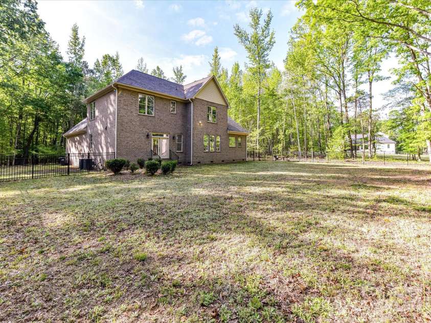 1409 Bloomsberry Lane, Waxhaw, NC 28173.  MLS# CAR4247521, YatesRealty ID 33651. Stunning full brick home