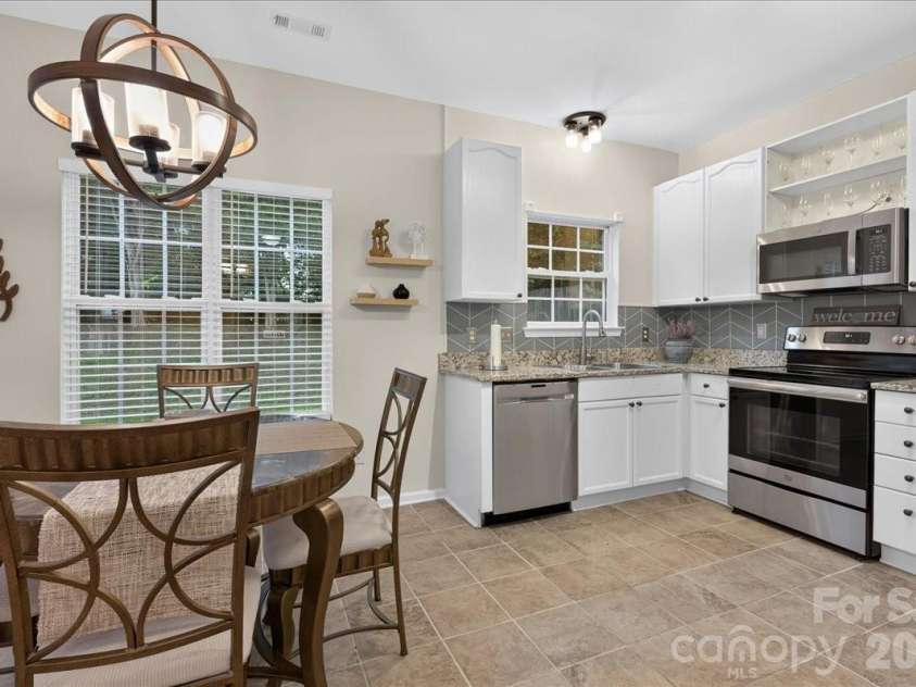 1519 Dillwin Road, Rock Hill, SC 29732.  MLS# CAR4282630, YatesRealty ID 33653. Updated designer lighting brightens the kitchen.