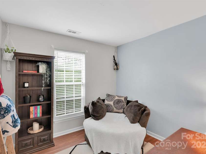 864 Tiger Lane, Charlotte, NC 28262.  MLS# CAR4278320, YatesRealty ID 33655. Cozy and versatile, this secondary bedroom is ideal for guests, a home office, or a stylish reading nook.