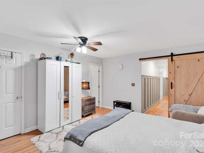 864 Tiger Lane, Charlotte, NC 28262.  MLS# CAR4278320, YatesRealty ID 33655. Large bedroom on main with en suite full bath and access to private patio space.