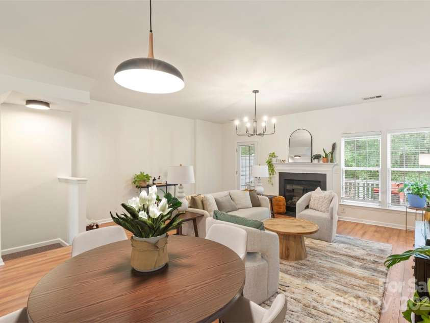 864 Tiger Lane, Charlotte, NC 28262.  MLS# CAR4278320, YatesRealty ID 33655. Living room opens to back porch and dining area has pass through to kitchen.