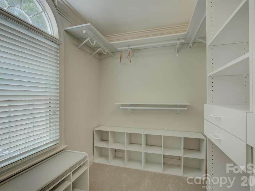 15608 Woodland Ridge Lane, Charlotte, NC 28278.  MLS# CAR4283839, YatesRealty ID 33663. Primary closet with built-in shelving. Two separate closets included at primary bathroom