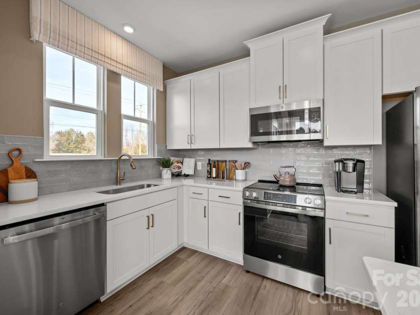 9031 Gulledge Court, Charlotte, NC 28262.  MLS# CAR4394692, YatesRealty ID 33664. DECORATED MODEL HOME