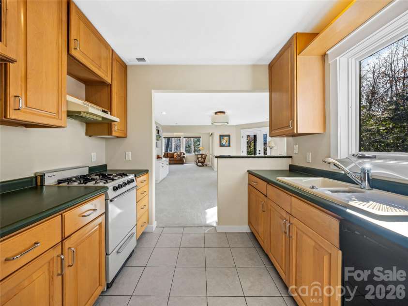339 Beaverdam Road, Asheville, NC 28804.  MLS# CAR4321982, YatesRealty ID 3367. A bright and practical second kitchen that makes independent living effortless—perfect for guests, in-laws, or anyone who enjoys having their own space to cook