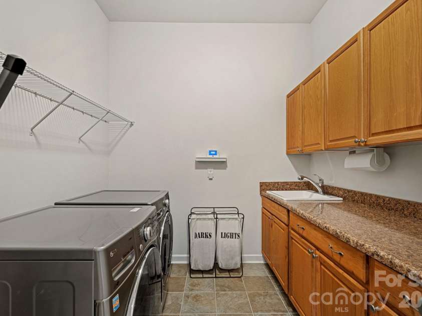 10654 Rippling Stream Drive, Concord, NC 28027.  MLS# CAR4387209, YatesRealty ID 33670. Large Laundry Room with sink