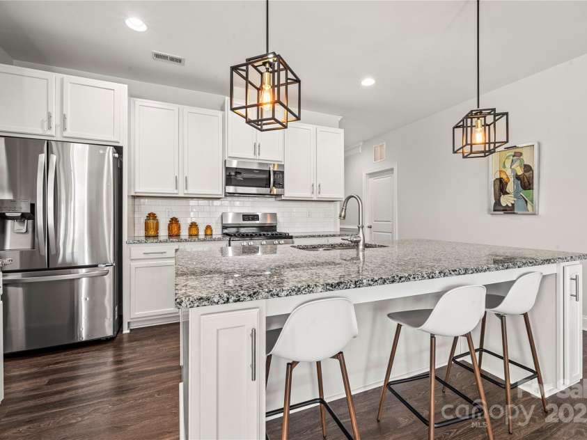 1009 Kemp Road, Indian Trail, NC 28079.  MLS# CAR4273624, YatesRealty ID 33685. Gas range, externally vented hood, ample counter space and large island