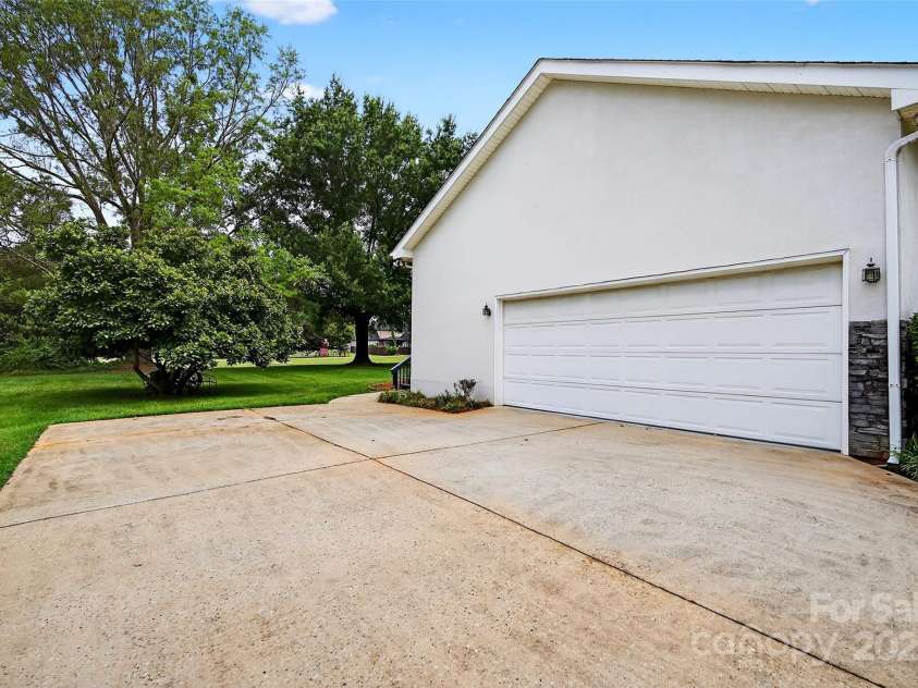 110 Old Squaw Road, Mooresville, NC 28117.  MLS# CAR4278838, YatesRealty ID 33687. Double side-load Garage