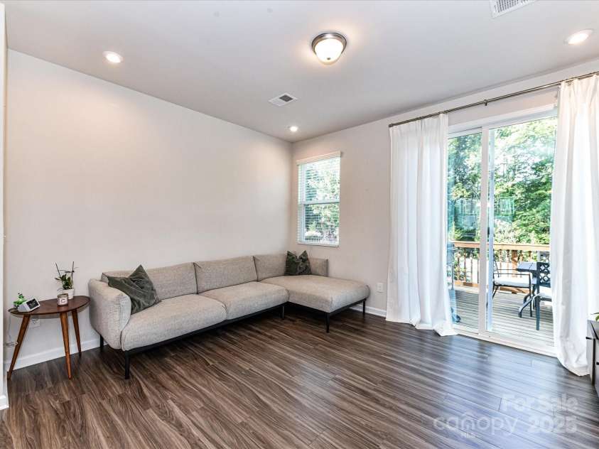 2313 Lazette Drive, Charlotte, NC 28216.  MLS# CAR4291354, YatesRealty ID 33693. Living Room with deck access!