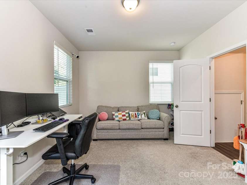 2313 Lazette Drive, Charlotte, NC 28216.  MLS# CAR4291354, YatesRealty ID 33693. Main level bedroom with full bath & patio access!