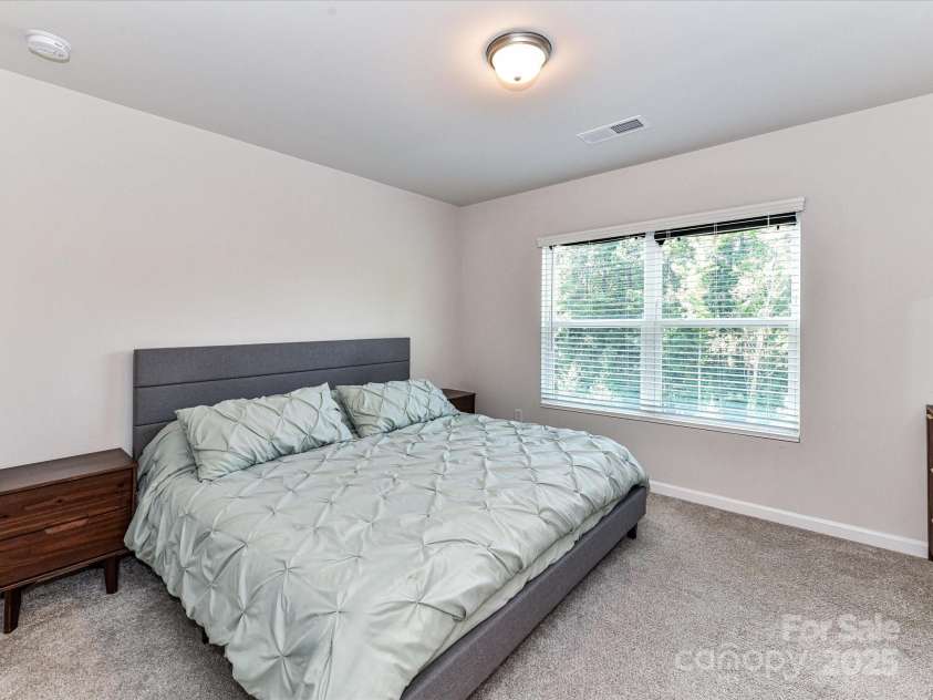 2313 Lazette Drive, Charlotte, NC 28216.  MLS# CAR4291354, YatesRealty ID 33693. Spacious Primary Bedroom on 3rd level with private bath & walk in closet!