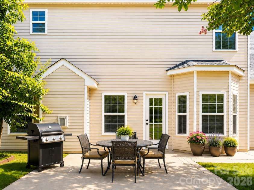 4857 Annelise Drive, Harrisburg, NC 28075.  MLS# CAR4392281, YatesRealty ID 33697. Back patio Virtual staging