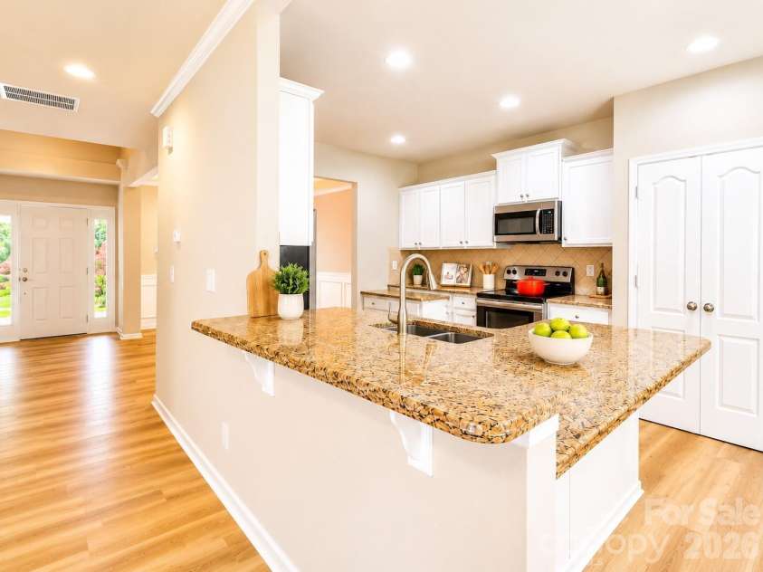 4857 Annelise Drive, Harrisburg, NC 28075.  MLS# CAR4392281, YatesRealty ID 33697. Kitchen bark and island