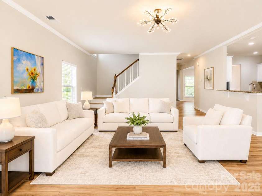 4857 Annelise Drive, Harrisburg, NC 28075.  MLS# CAR4392281, YatesRealty ID 33697. Living room Virtual staging