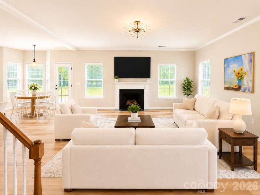 4857 Annelise Drive, Harrisburg, NC 28075.  MLS# CAR4392281, YatesRealty ID 33697. Living room Virtual staging