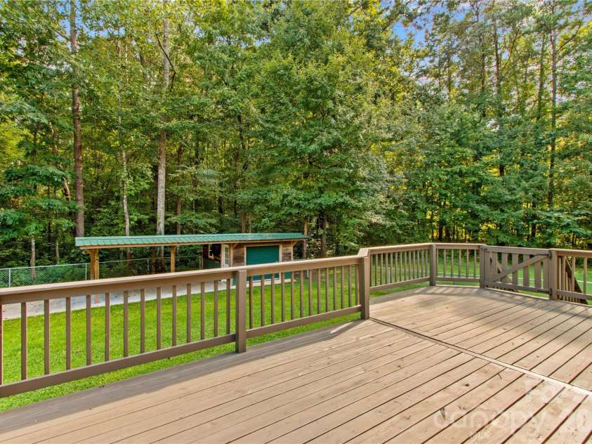 215 Meadow Lake Drive, Salisbury, NC 28146.  MLS# CAR4291335, YatesRealty ID 33699. Add some deck furniture, a table and enjoy the fresh air and woods view