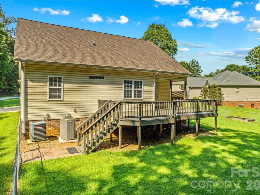215 Meadow Lake Drive, Salisbury, NC 28146.  MLS# CAR4291335, YatesRealty ID 33699. Stairs to backyard or gate to sideyard