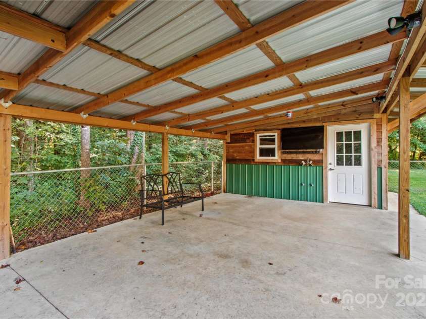 215 Meadow Lake Drive, Salisbury, NC 28146.  MLS# CAR4291335, YatesRealty ID 33699. Watch a movie or the big game outside!