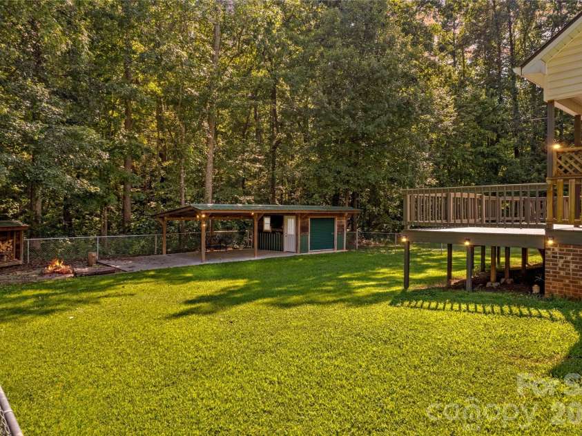 215 Meadow Lake Drive, Salisbury, NC 28146.  MLS# CAR4291335, YatesRealty ID 33699. Yard slope gently away from the house.