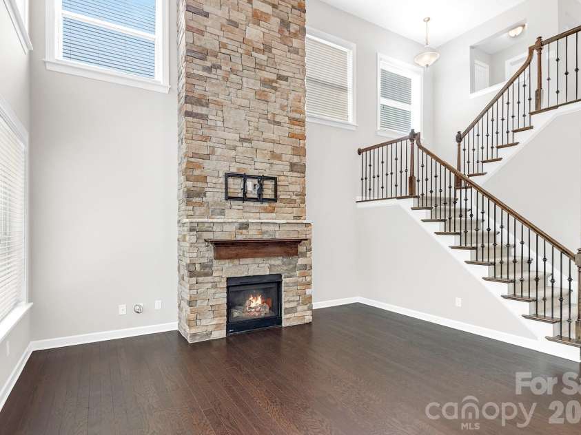 3108 Helmsley Court, Concord, NC 28027.  MLS# CAR4390077, YatesRealty ID 33701. Great Room with Stone Fireplace