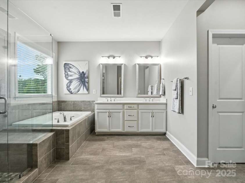 2033 Folkstone Lane, Lancaster, SC 29720.  MLS# CAR4287306, YatesRealty ID 33712. Spa Like Primary Bath- Custom Tile work