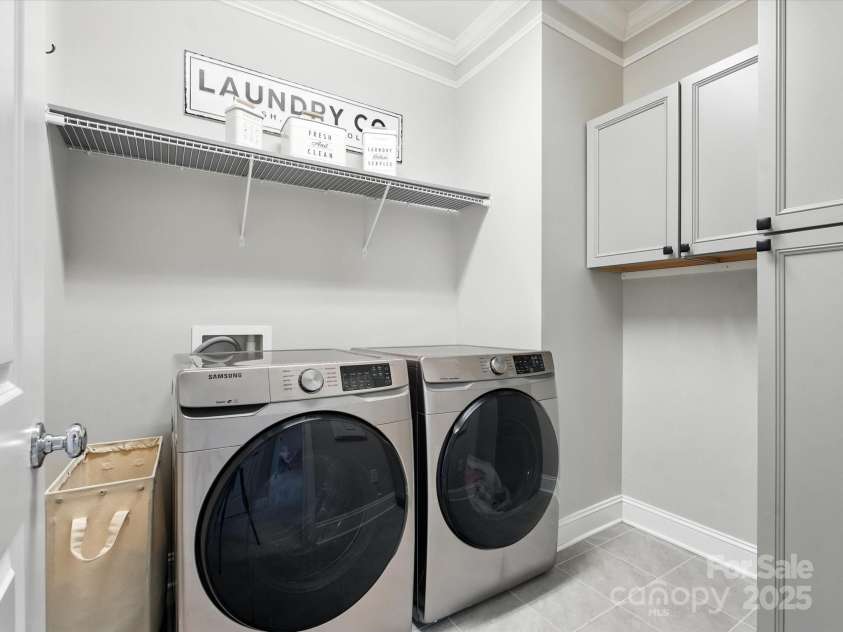 2033 Folkstone Lane, Lancaster, SC 29720.  MLS# CAR4287306, YatesRealty ID 33712. Spacious Laundry with Cabinets for storage