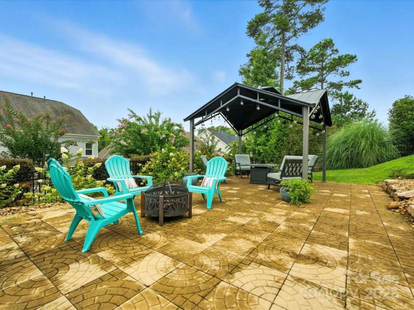 2033 Folkstone Lane, Lancaster, SC 29720.  MLS# CAR4287306, YatesRealty ID 33712. This a whole different world to enjoy ! Gradual steps lead to a Pergola with a custom patio and star gazing at its best!
