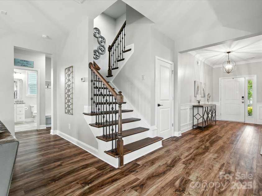 2033 Folkstone Lane, Lancaster, SC 29720.  MLS# CAR4287306, YatesRealty ID 33712. Wooden Stairs w/ Decorative Rails look like a piece of Art!