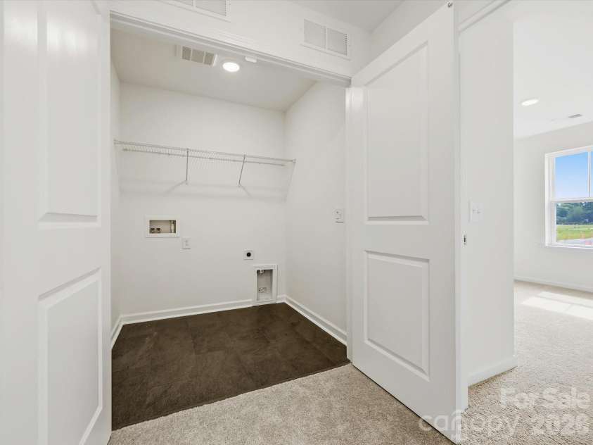 6613 Fire Lily Lane, Charlotte, NC 28216.  MLS# CAR4426558, YatesRealty ID 33719. Laundry Area