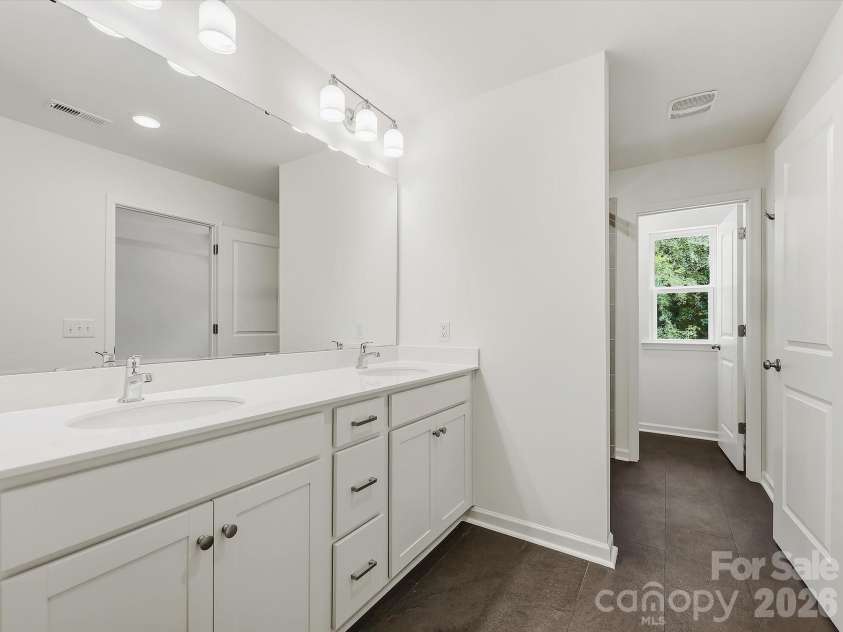 6613 Fire Lily Lane, Charlotte, NC 28216.  MLS# CAR4426558, YatesRealty ID 33719. Owner's Bathroom Offering a Double Sink Vanity