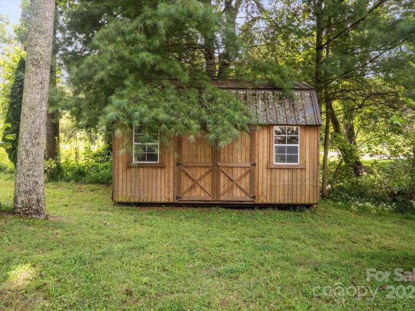 142 Pinners Cove Road, Asheville, NC 28803.  MLS# CAR4287127, YatesRealty ID 33723. 12x16 dual-lofted shed for extra storage or workspace.