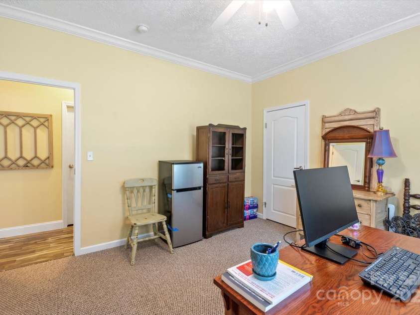 142 Pinners Cove Road, Asheville, NC 28803.  MLS# CAR4287127, YatesRealty ID 33723. Bedroom #1 used as an office looking towards hallway.