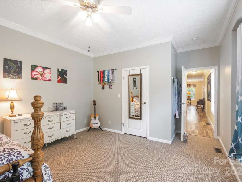 142 Pinners Cove Road, Asheville, NC 28803.  MLS# CAR4287127, YatesRealty ID 33723. Bedroom #2 with walk-in closet looking towards the hallway.