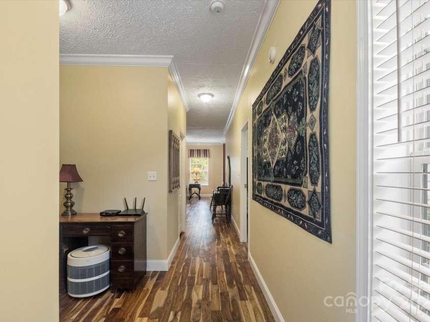 142 Pinners Cove Road, Asheville, NC 28803.  MLS# CAR4287127, YatesRealty ID 33723. Hallway leading back to living room.