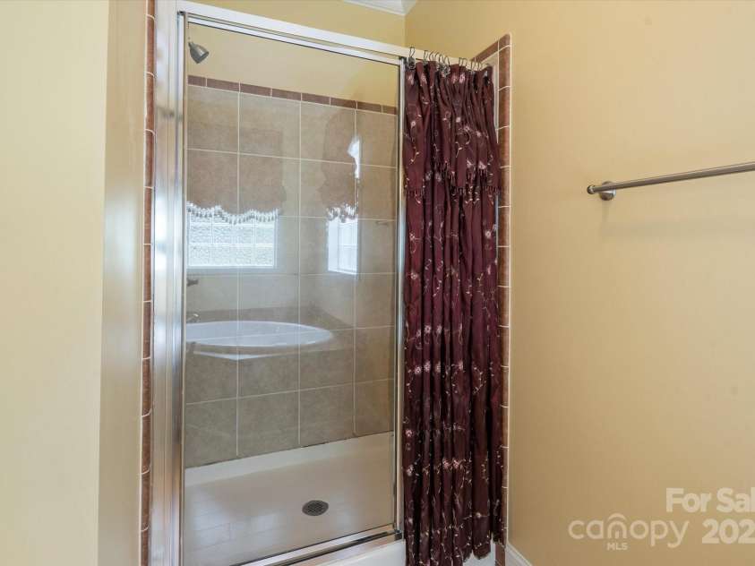 142 Pinners Cove Road, Asheville, NC 28803.  MLS# CAR4287127, YatesRealty ID 33723. Shower in primary bathroom.