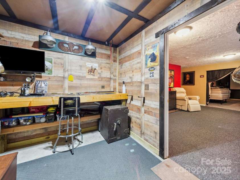 130 Nims Spring Drive, Fort Mill, SC 29715.  MLS# CAR4272422, YatesRealty ID 33730. Basement Workshop