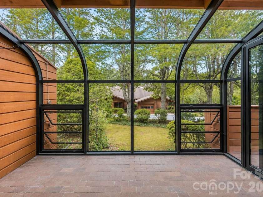 601 Woodfield Drive, Asheville, NC 28803.  MLS# CAR4397478, YatesRealty ID 33736. Three Season Sunroom