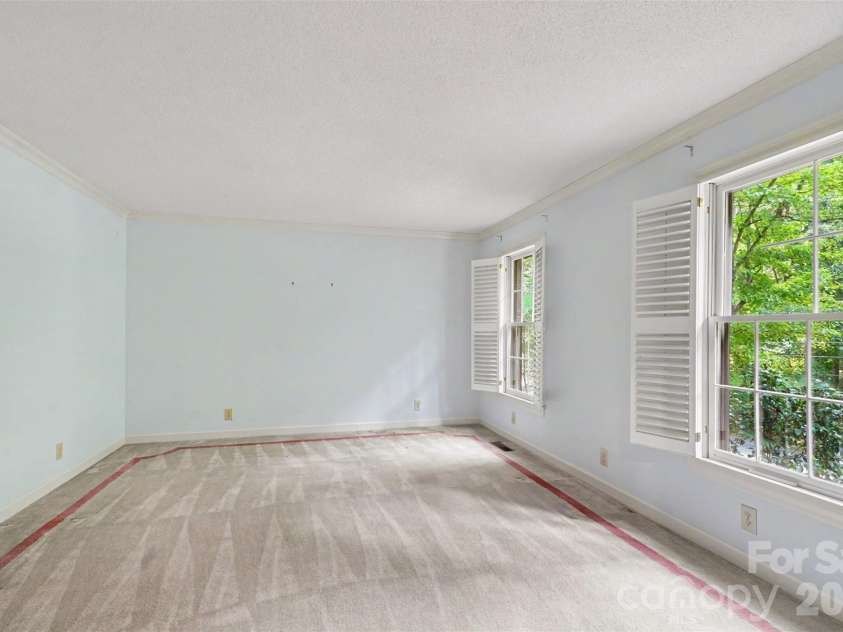 215 Chedworth Court, Concord, NC 28025.  MLS# CAR4396675, YatesRealty ID 33737. Formal Living room with plantation shutters